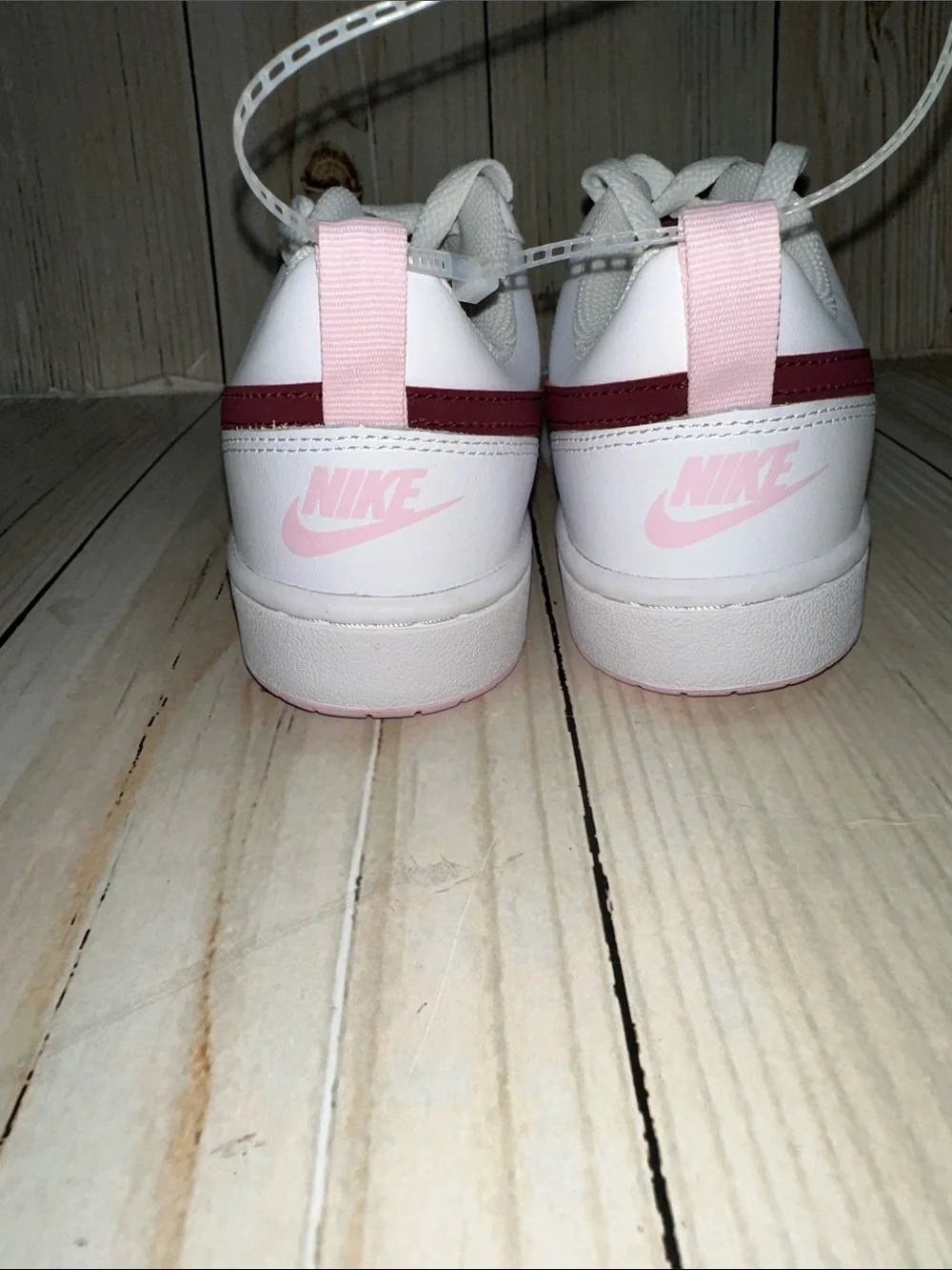 Nike White Sneakers with Maroon Swoosh and Pink Heel Tab